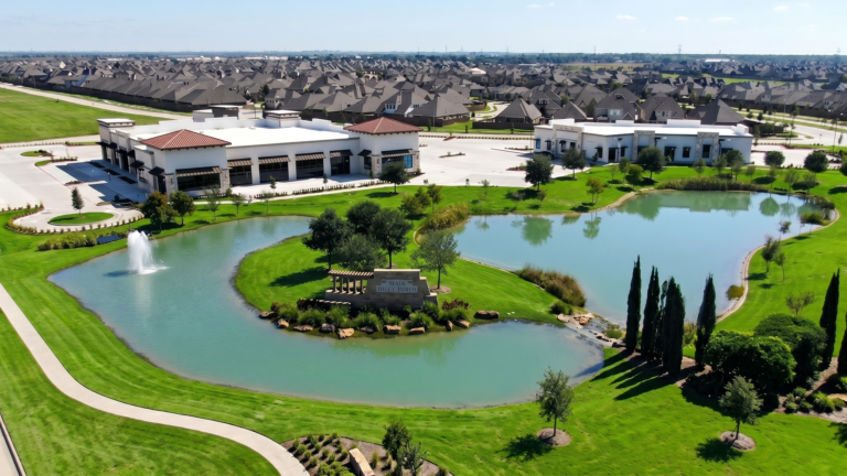 Aerial view of Bella Piazza Retail Center with decorative pond and fountain, Richmond, TX - Keeton Construction Services
