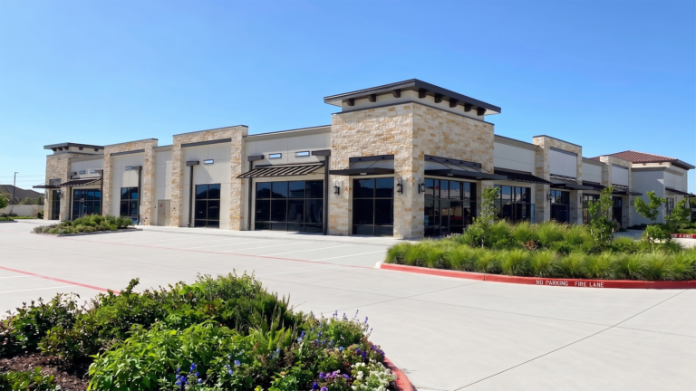 Exterior view of Bella Piazza Retail Center storefronts and parking area, Richmond, TX - Keeton Construction Services