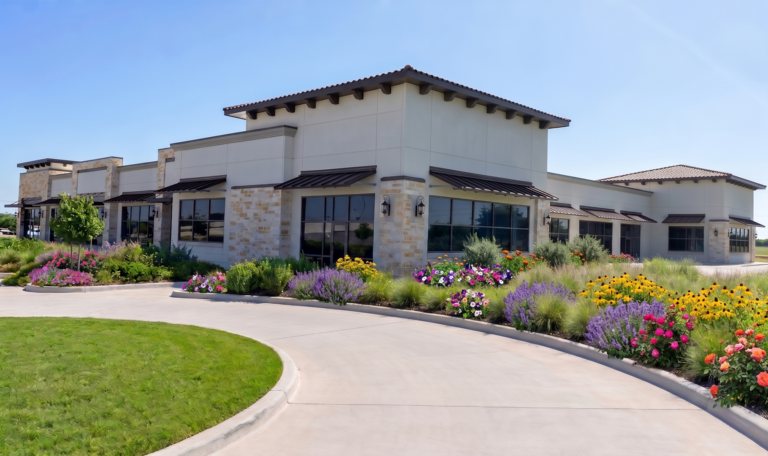 Exterior corner view of Bella Piazza Retail Center main building with landscaping, Richmond, TX - Keeton Construction Services