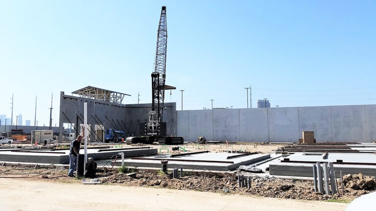 LA Fitness Center Houston TX - site work in progress with crane and precast panels on the ground, Keeton Construction Services