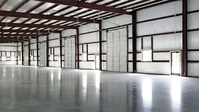 Interior warehouse space at FM 529 Business Park Office/Warehouse Flex Space Phase I in Houston, TX by Keeton Construction Services, with overhead doors and exposed structural framing