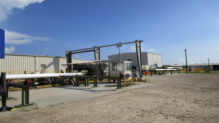 Socotherm Gulf of Mexico in Channelview, TX - industrial yard with metal buildings, structural steel frame, and pipe sections on rollers, Keeton Construction Services