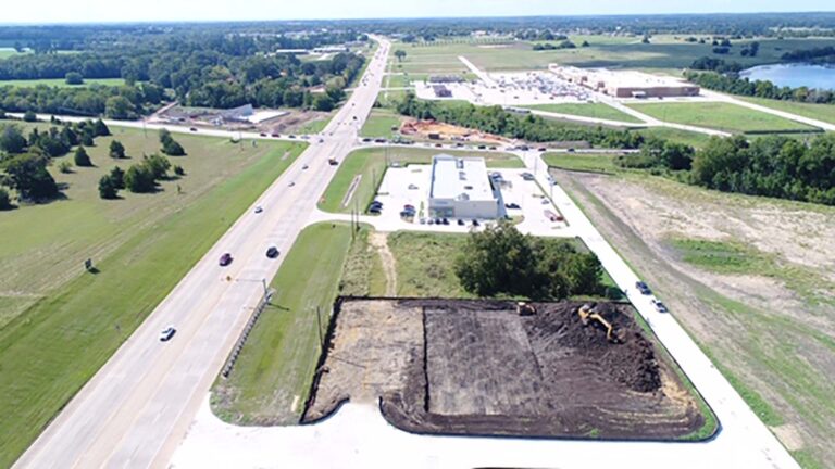 Aerial view of the 105 Retail Center site during construction in Montgomery, TX, by Keeton Construction Services, with earthmoving equipment on a cleared pad