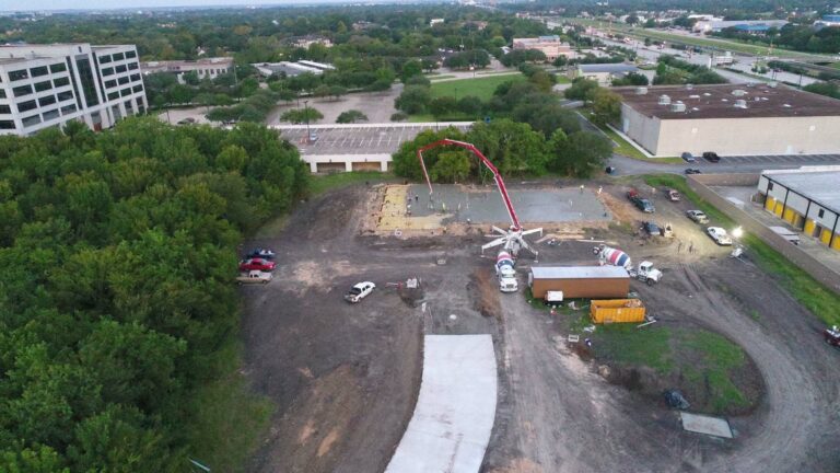 Aerial view of Mueller Law Group site in Sugarland, TX during concrete slab pour by Keeton Construction Services