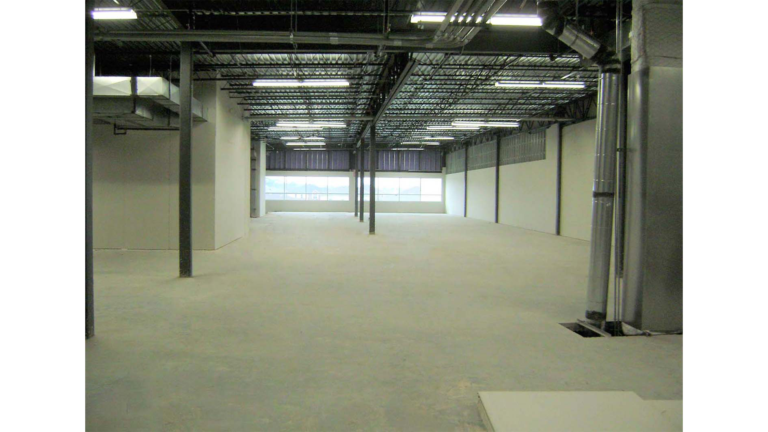 Interior warehouse bay at Jakes Finer Foods in Houston, TX by Keeton Construction Services, showing open floor area and exposed structural steel