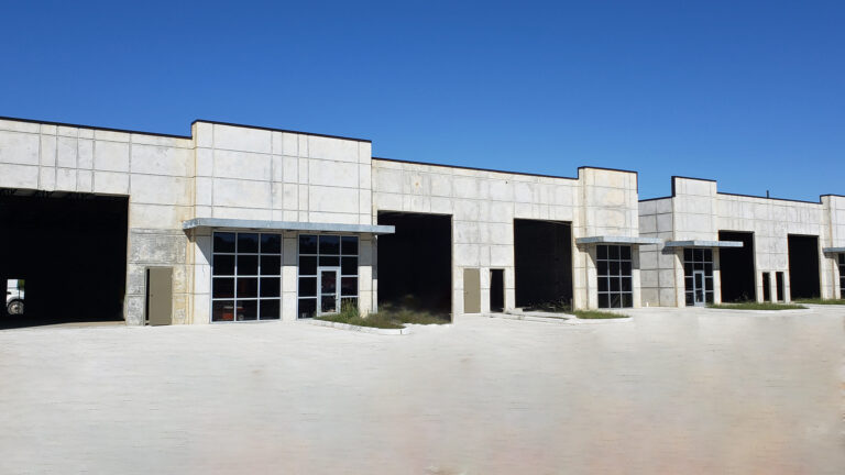 Park 723 Office/Warehouse Flex Space in Rosenberg, TX - exterior of a warehouse building with multiple overhead bays and paved apron, by Keeton Construction Services