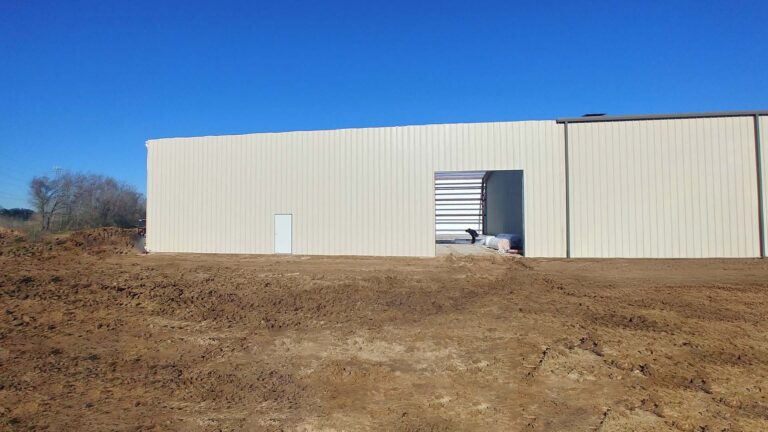 Precision Piping Products building exterior during construction in Houston TX by Keeton Construction Services, bare dirt and open bay