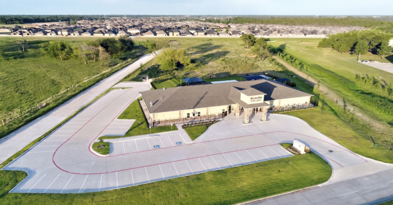 Aerial view of Kiddie Academy Child Care Mueschke building and parking lot by Keeton Construction Services, Cypress, TX