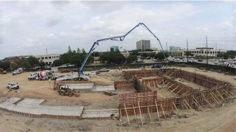 2525 City West Parking Garage and Condos, Houston TX - active construction site with concrete pump and mixer trucks, Keeton Construction Services
