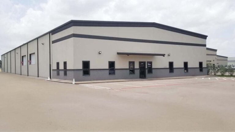 Precision Piping Products building exterior in Houston TX by Keeton Construction Services, corner view with parking area