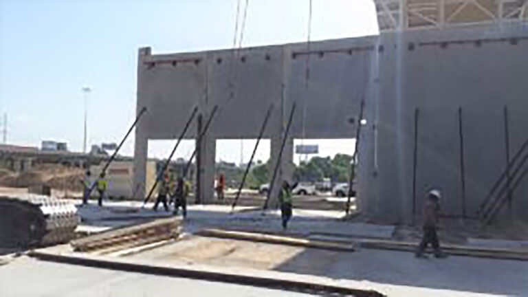 LA Fitness Center in Houston, TX - workers erecting large precast panels during construction, Keeton Construction Services