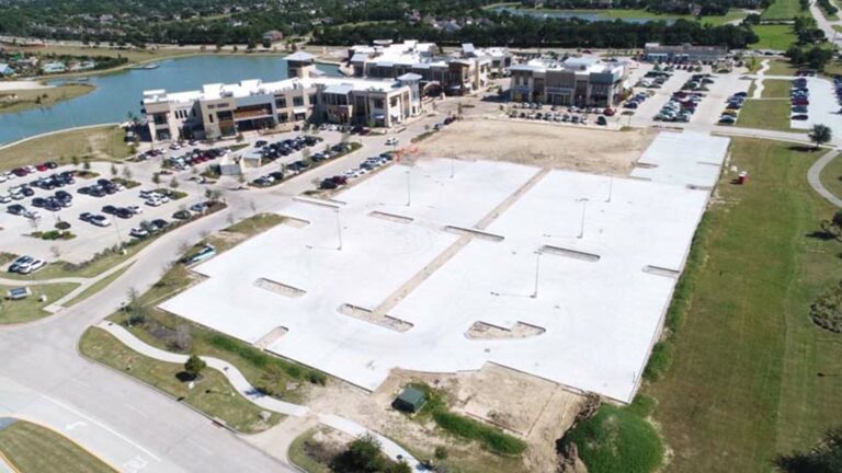 Aerial view of the Towne Lake Boardwalk Center parking area during construction in Houston, TX by Keeton Construction Services