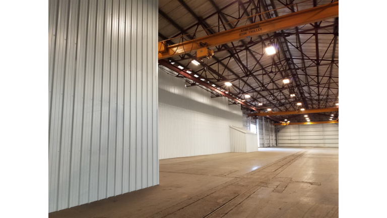 Interior bay of the National Oilwell Varco facility in Houston TX with an overhead crane and open floor area, a Keeton Construction Services project
