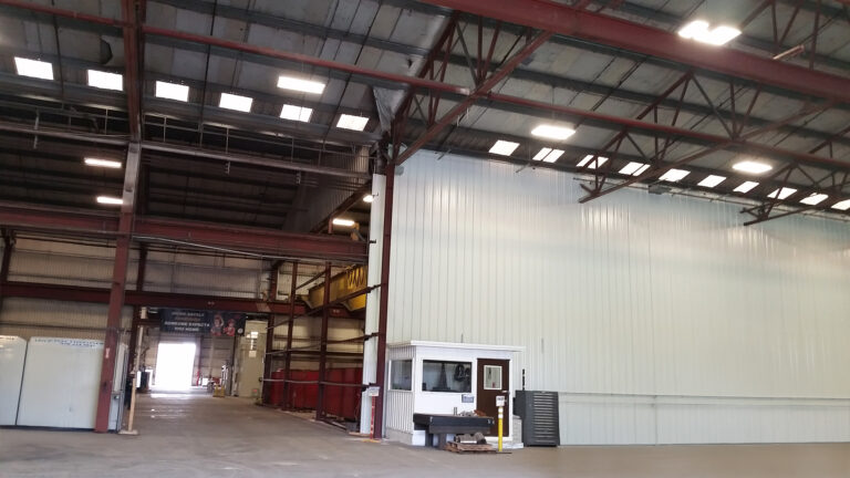 National Oilwell Varco facility interior in Houston TX showing a guard booth and metal partition wall, a Keeton Construction Services project