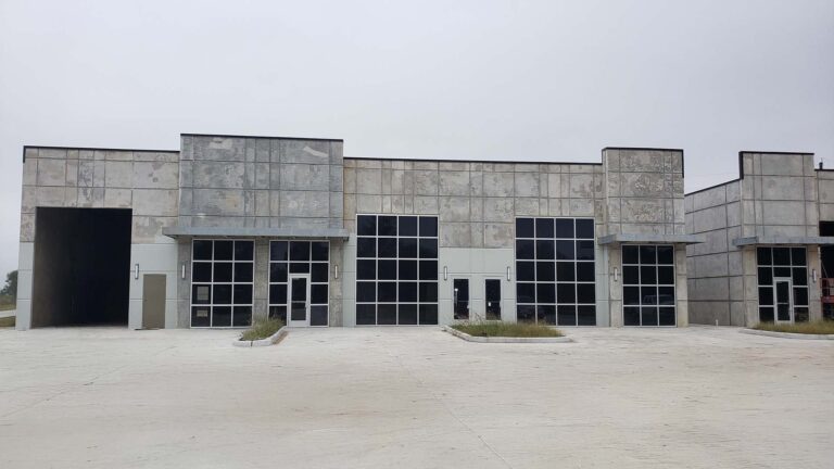 Park 723 Office/Warehouse Flex Space in Rosenberg, TX - row of warehouse units with glazed storefront doors and overhead bays, by Keeton Construction Services