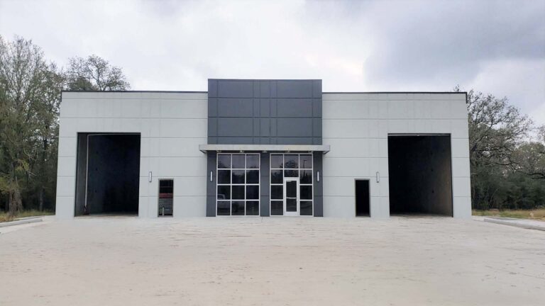 Park 723 Office/Warehouse Flex Space in Rosenberg, TX - front-on exterior view of an end unit with overhead bays and glazed entry, by Keeton Construction Services