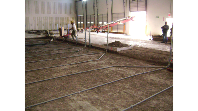 Penske Logistics in Houston TX - interior floor work during construction by Keeton Construction Services, rebar grid and workers visible