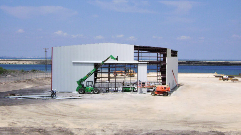 Helix Energy Solutions Spool Base in Ingleside, TX - structural steel frame being erected with lift equipment during construction, by Keeton Construction Services