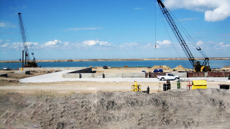 Helix Energy Solutions Spool Base in Ingleside, TX - foundation work and cranes on the waterfront site during construction, by Keeton Construction Services