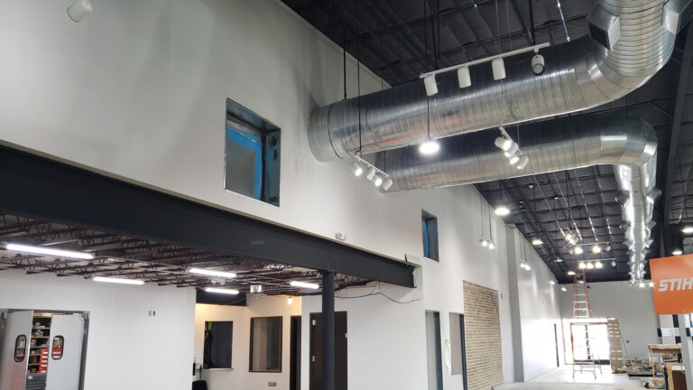 Ewald Kubota Equipment Dealership Houston TX - interior during construction showing exposed ductwork and unfinished walls, by Keeton Construction Services