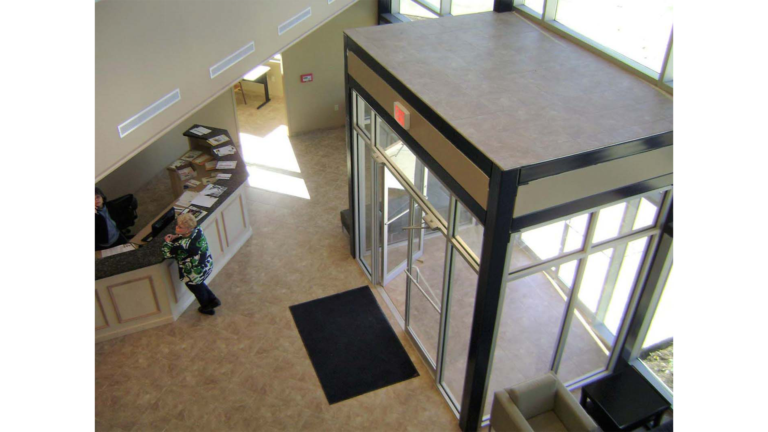 Interior lobby of Jakes Finer Foods in Houston, TX by Keeton Construction Services, viewed from above showing the reception desk area