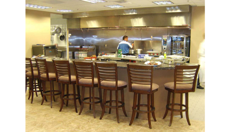 Interior kitchen and bar seating area at Jakes Finer Foods in Houston, TX by Keeton Construction Services