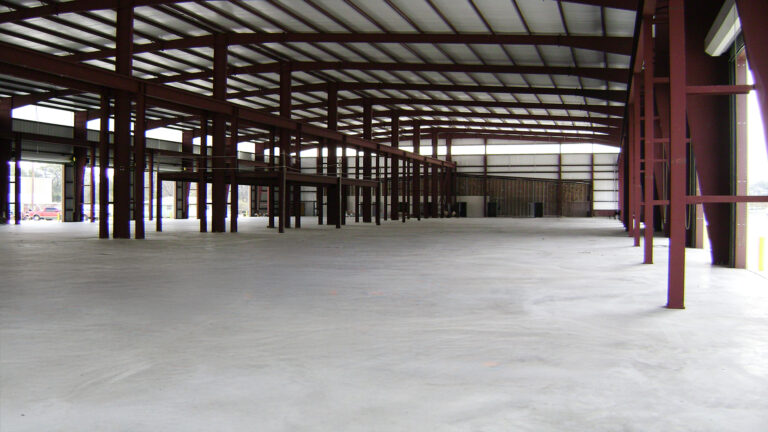 Interior during construction at Master Rig International in Houston, TX by Keeton Construction Services showing structural framing and a partial mezzanine structure