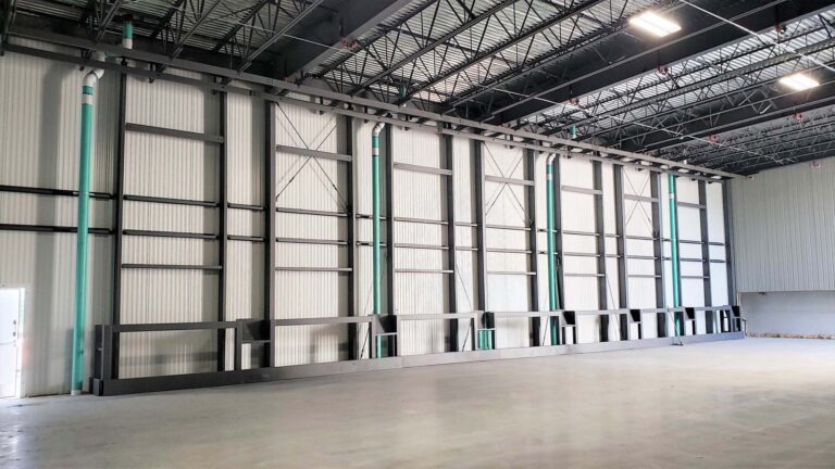 Interior warehouse bay at the Labatt Food Service facility in Houston, TX showing tall paneled walls, Keeton Construction Services