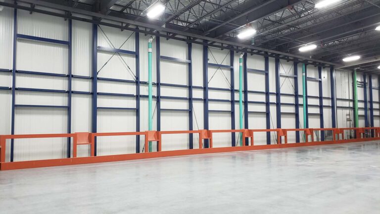Interior warehouse bay at the Labatt Food Service project in Houston, TX with structural columns and dock equipment, Keeton Construction Services