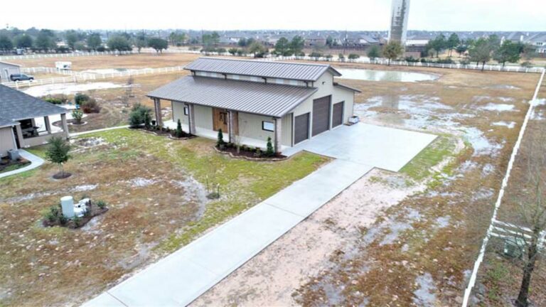 Aerial view of the Metal Barn building with a metal roof and garage doors, built by Keeton Construction Services