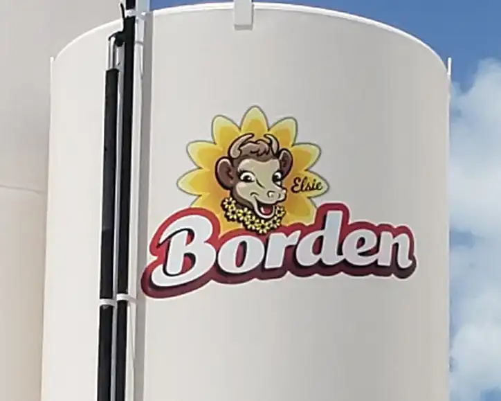 Close-up of the Borden Elsie logo on a silo at Borden Dairy, Houston, TX - Keeton Construction Services