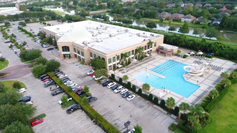 Aerial view of the Lifetime Fitness building and outdoor pool area in Sugarland, TX, a project by Keeton Construction Services