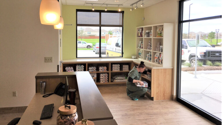 Interior retail and display area at Fairfield Animal Hospital in Cypress, TX built by Keeton Construction Services, with built-in shelving and cabinetry
