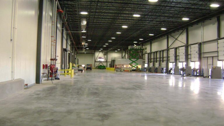 Interior warehouse during construction at Jakes Finer Foods in Houston, TX by Keeton Construction Services, with lift equipment on the floor