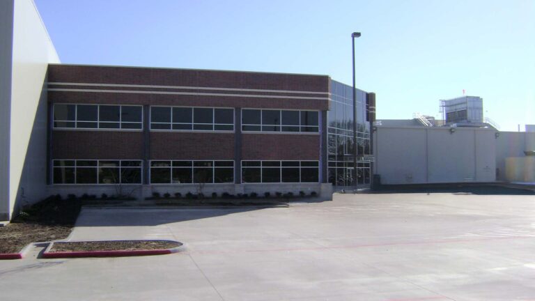 Side exterior of Jakes Finer Foods in Houston, TX by Keeton Construction Services, showing the office wing and adjacent warehouse structure