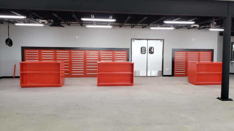 Ewald Kubota Equipment Dealership Houston TX - interior parts room with storage cabinets and display shelving, by Keeton Construction Services