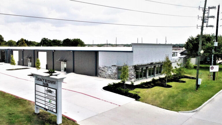 Exterior of Legacy Business Park in Cypress TX with project signage in the foreground by Keeton Construction Services