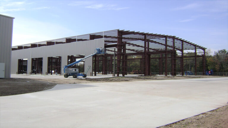 Steel framing during construction at Master Rig International in Houston, TX by Keeton Construction Services with a lift on site