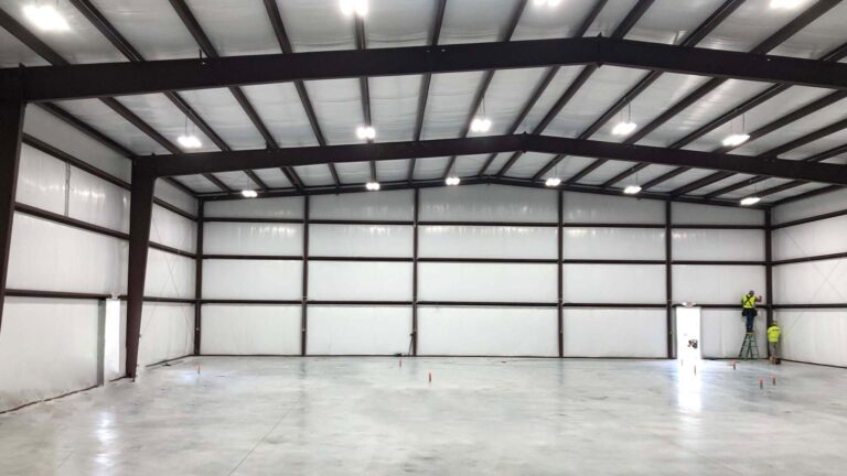 Precision Piping Products interior space in Houston TX by Keeton Construction Services, large open bay with steel framing and concrete floor
