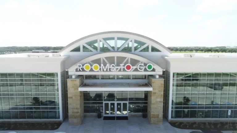 Rooms To Go Retail Center in Houston TX - aerial close-up of main entrance arch and signage, Keeton Construction Services