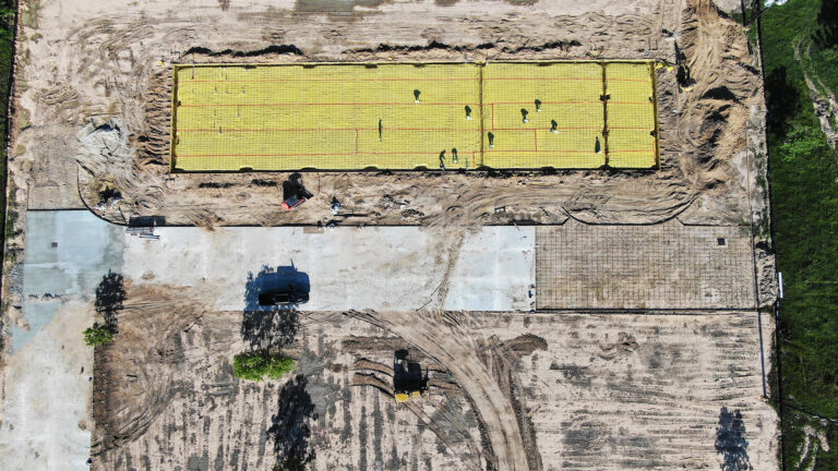 Aerial view of the United Laser Cladding site in Cypress, TX during construction by Keeton Construction Services, showing slab forms and equipment from above