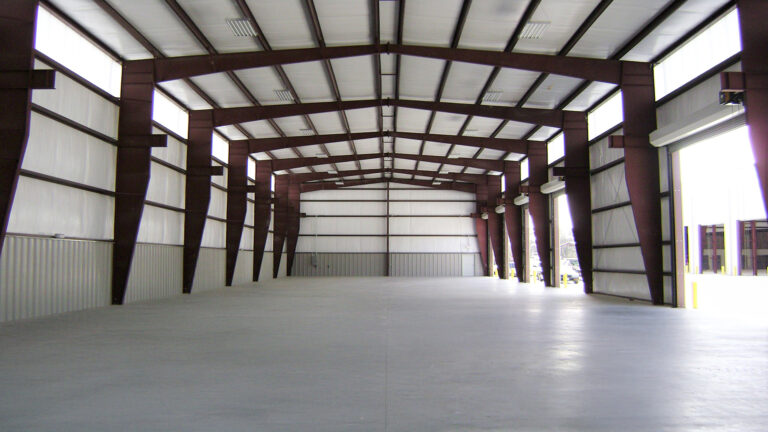 Interior of a metal building at Master Rig International in Houston, TX by Keeton Construction Services showing an open bay with structural framing