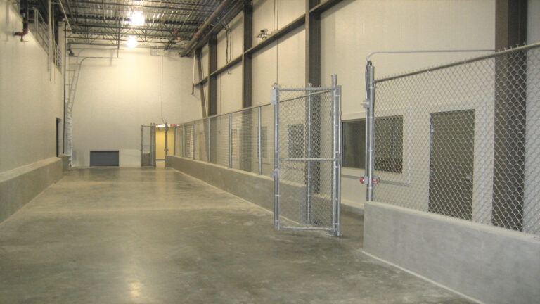 Interior warehouse space at the Labatt Food Service project in Houston, TX with interior security fencing, Keeton Construction Services