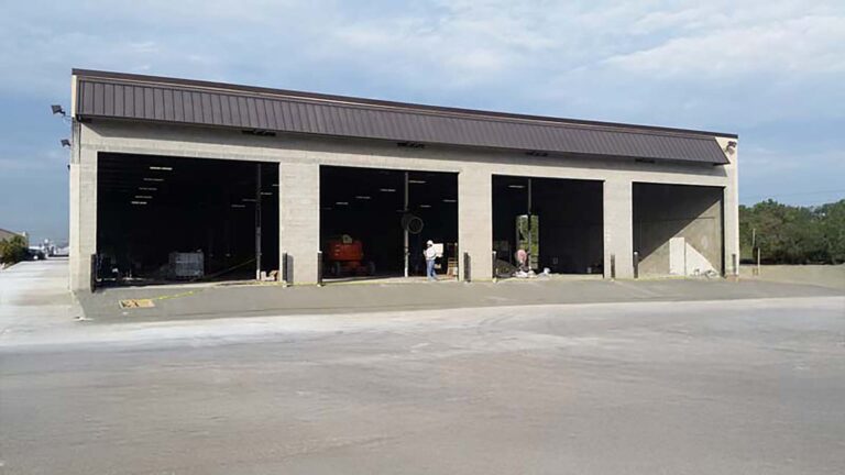 Building exterior with open bays during construction at Trelleborg Offshore Engineered Systems in Houston, TX - Keeton Construction Services