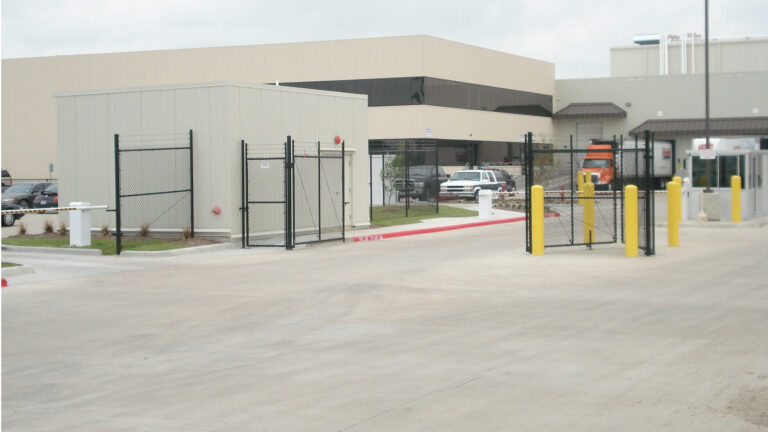 Gated site entry with security fencing at the Labatt Food Service project in Houston, TX by Keeton Construction Services