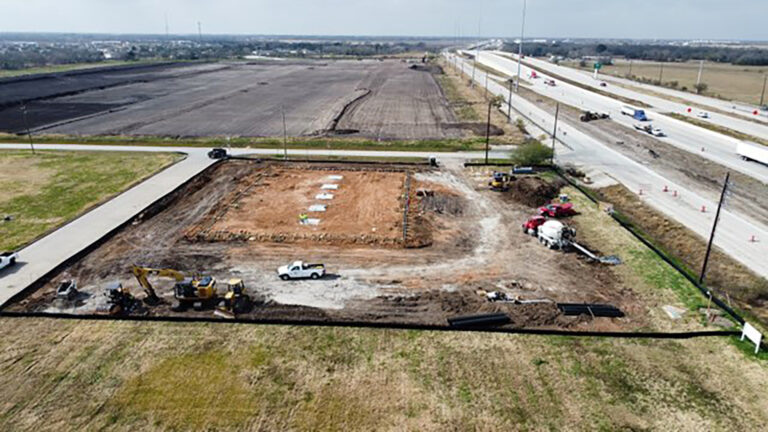 Harbor Freight Rosenberg, TX - aerial view of the site during construction with excavation equipment, Keeton Construction Services