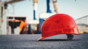 red construction hat on construction site for Houston general contractor