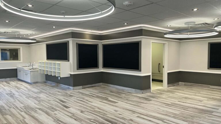 Interior classroom with wall-mounted screens and shelving at Prescolaire Early Learning Academy Spring, Keeton Construction Services, Spring, TX