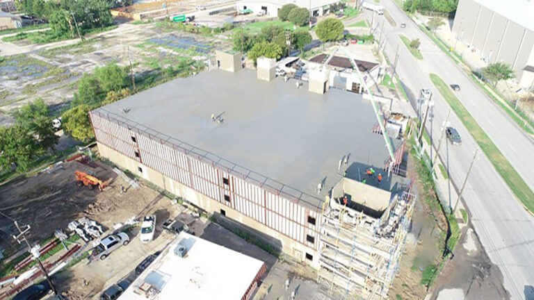 Aerial view of OST Storage Facility during construction in Houston TX by Keeton Construction Services, scaffolding and crane visible on site