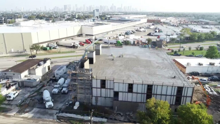 Aerial view of OST Storage Facility during construction in Houston TX by Keeton Construction Services, concrete mixer trucks and crew visible on site